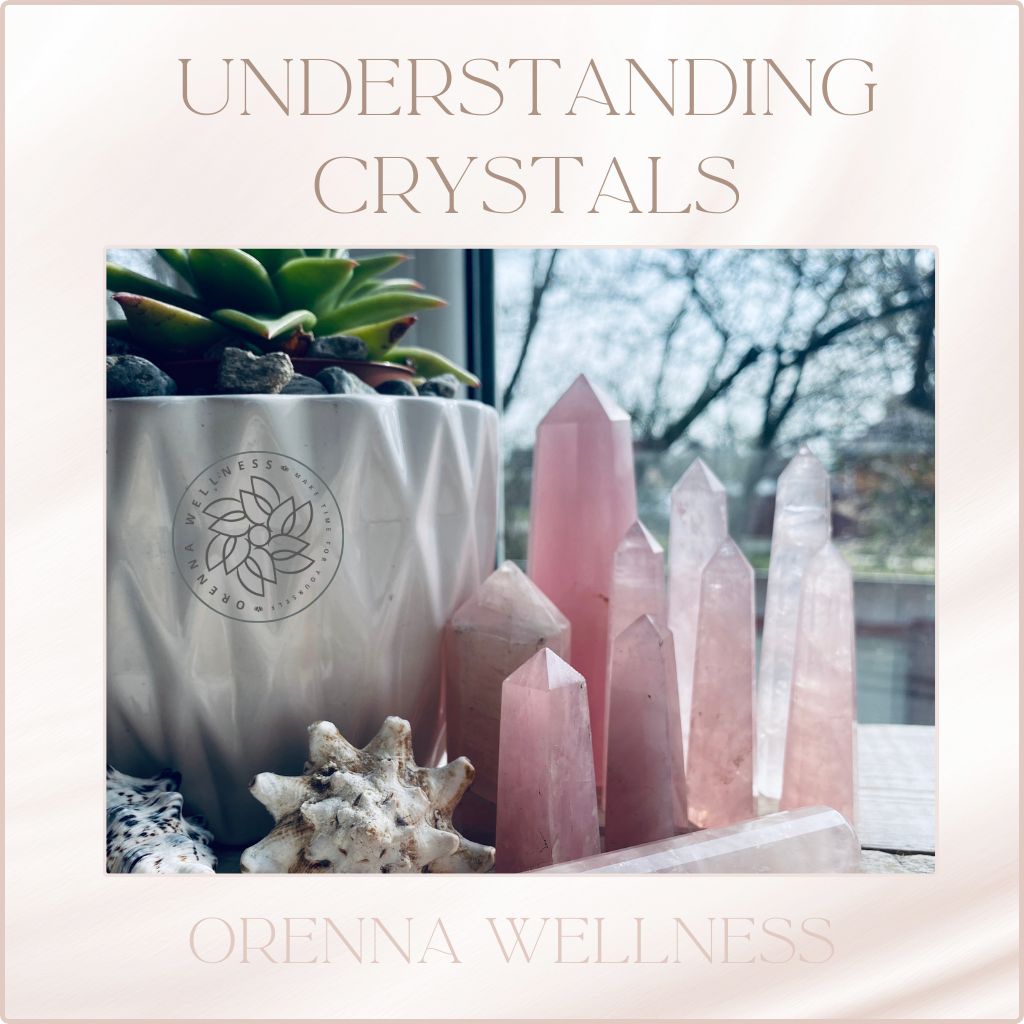 Crystal Healing Workshop - a Table with rose quartz crystals and a green plant