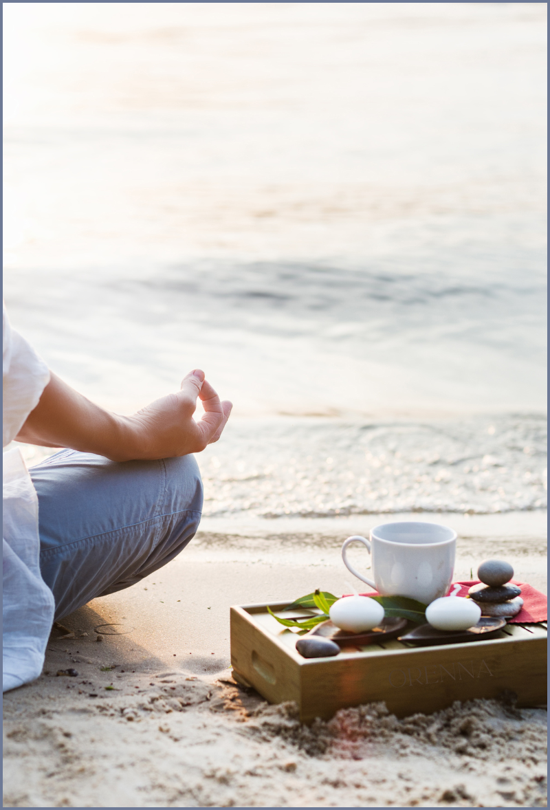 Woman in a meditation session on a beach for what is meditation