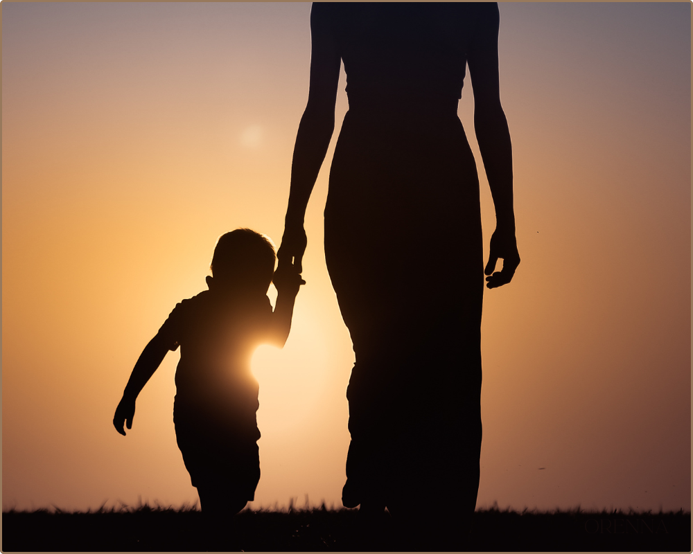 about orenna experience Woman and child silhouette walking on sunset