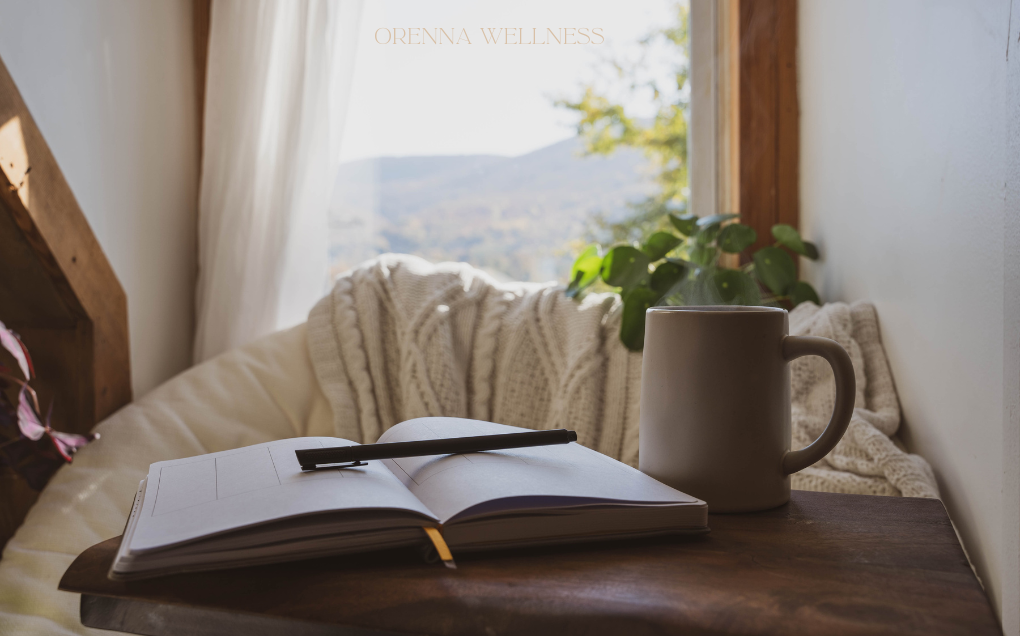 private sessions Journal cup of tea on a wooden table top with a homie background