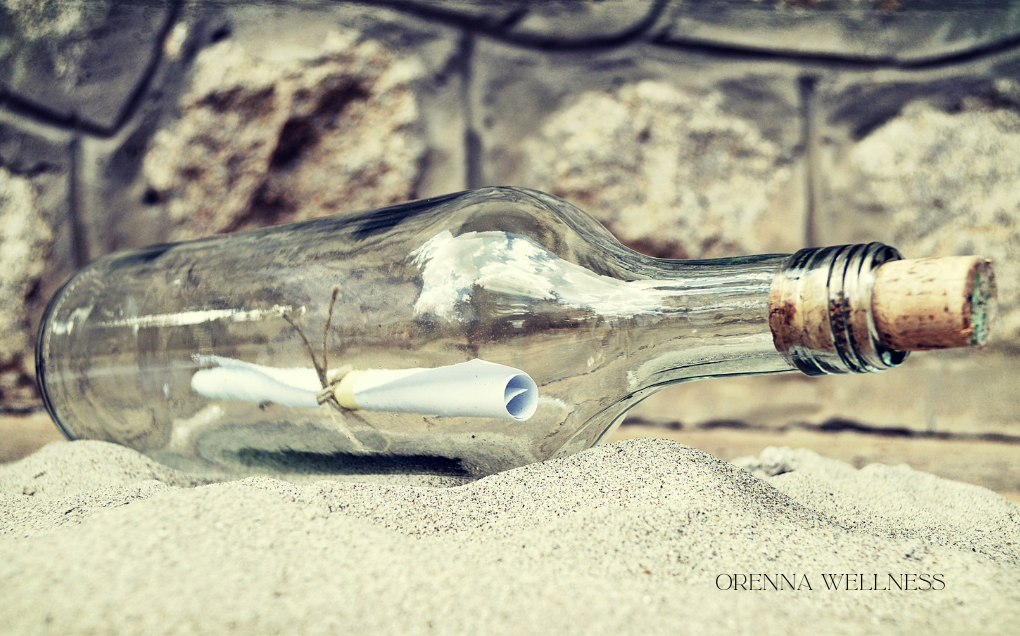 private sessions precis Message in a bottle on white sand and transparent bottle