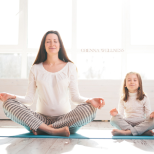 a mom and her daughter doing yoga meditation sessions