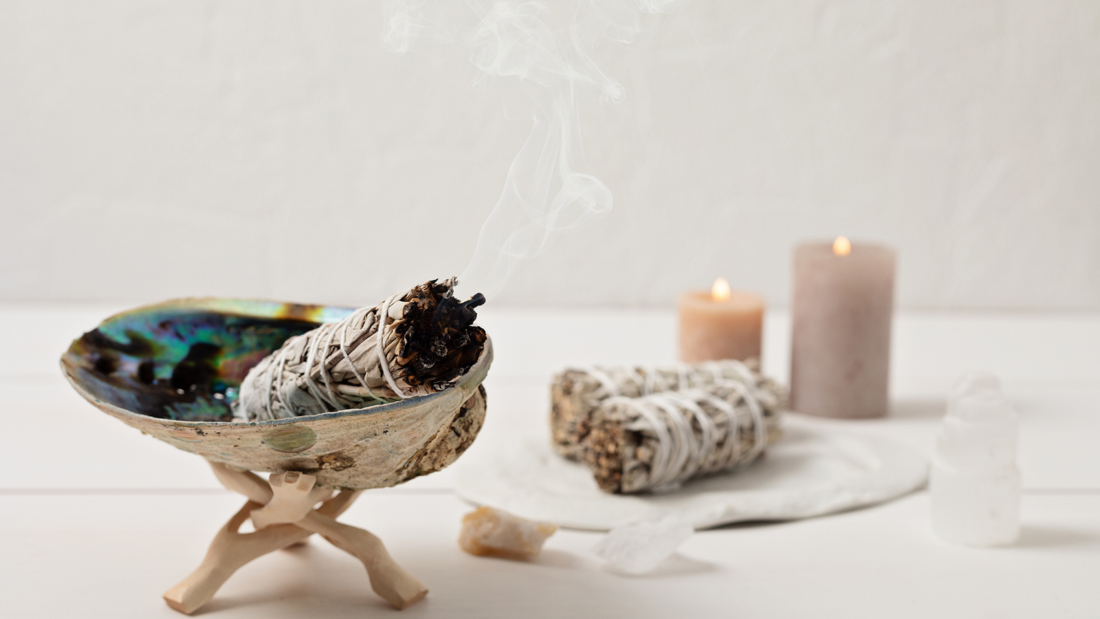 white sage burning and candles