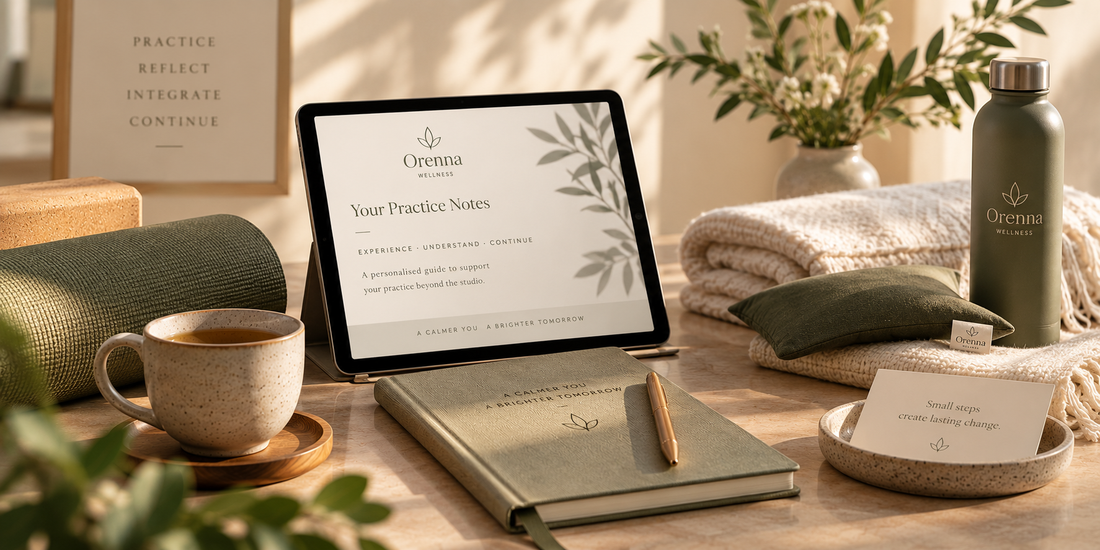 Tablet displaying personalised Orenna Practice Notes beside a journal, herbal tea and yoga props.